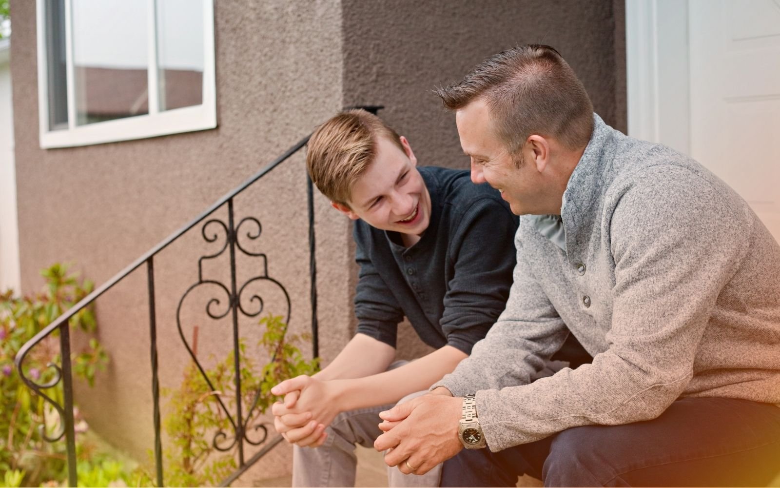 Father and Son Talking To Each Other