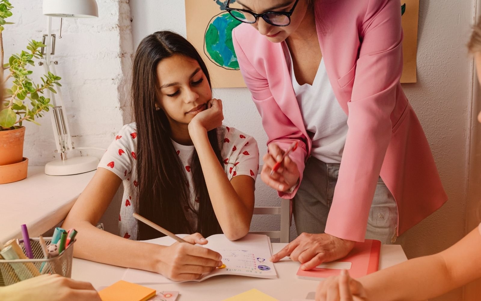 Teen Reviewing Work With Coach